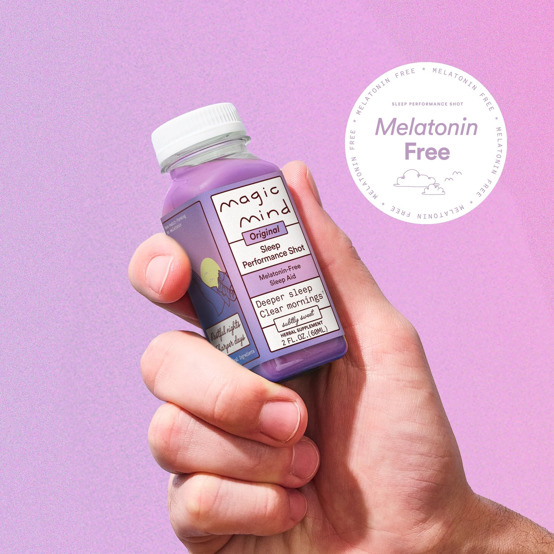 Hand presenting a purple labeled Magic Mind performance shot.