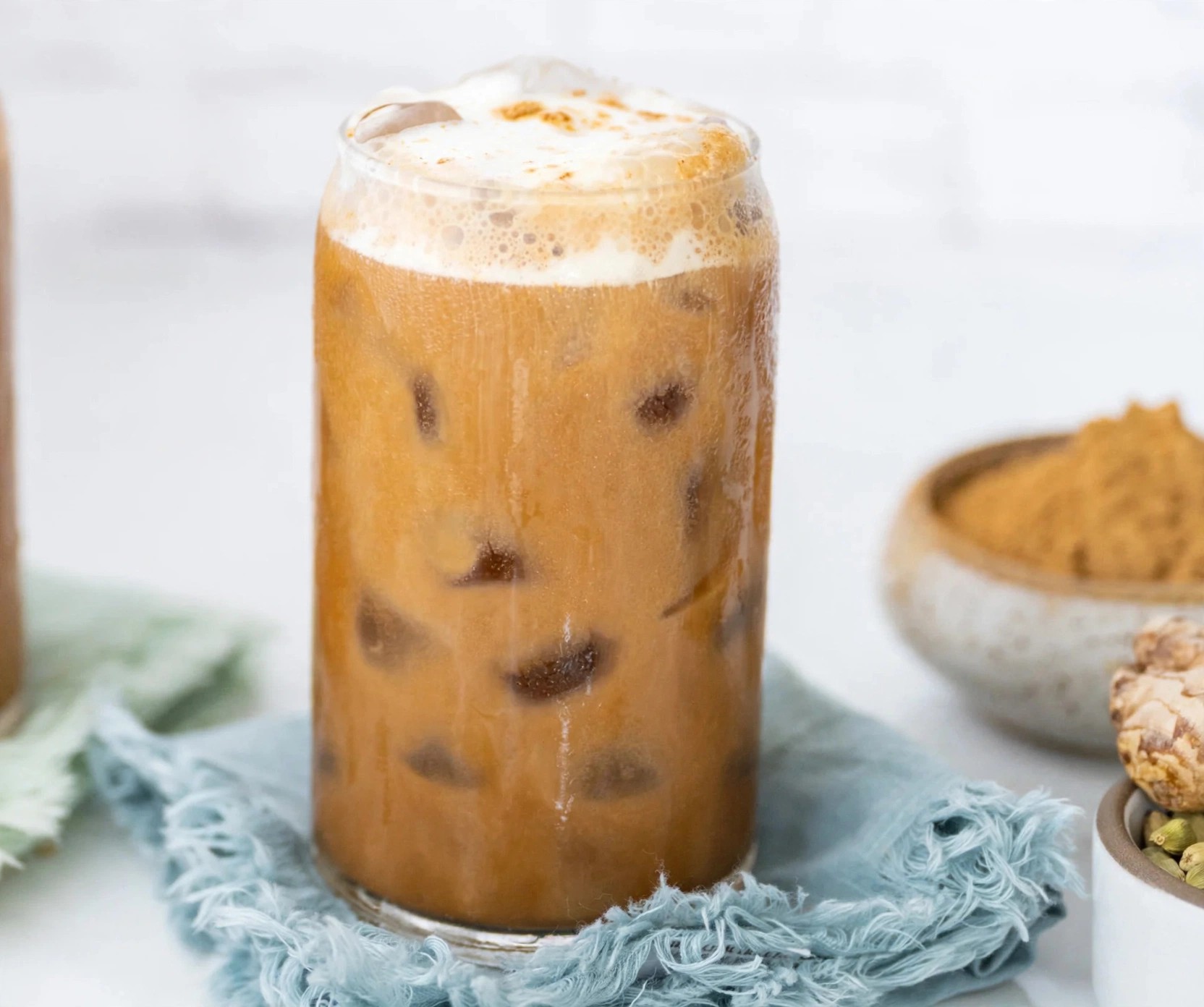 Iced coffee alternative styled with ingredients on table.